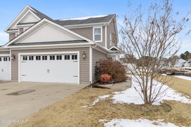 view of snowy exterior with a garage