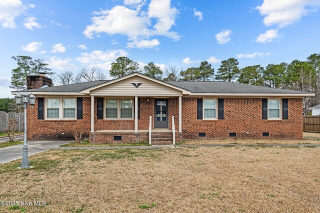 ranch-style home featuring a front lawn, a carport, and a porch