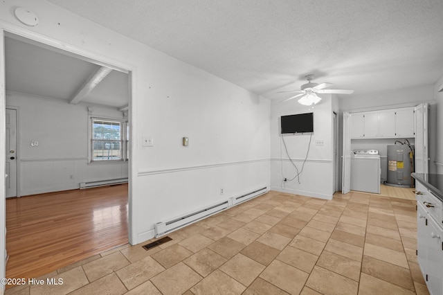 kitchen with electric water heater, white cabinets, and baseboard heating