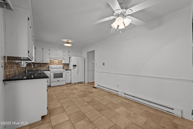 kitchen with sink, backsplash, a baseboard radiator, white appliances, and white cabinets