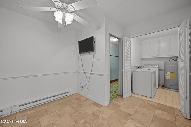 washroom featuring cabinets, a baseboard heating unit, ceiling fan, washing machine and dryer, and electric water heater