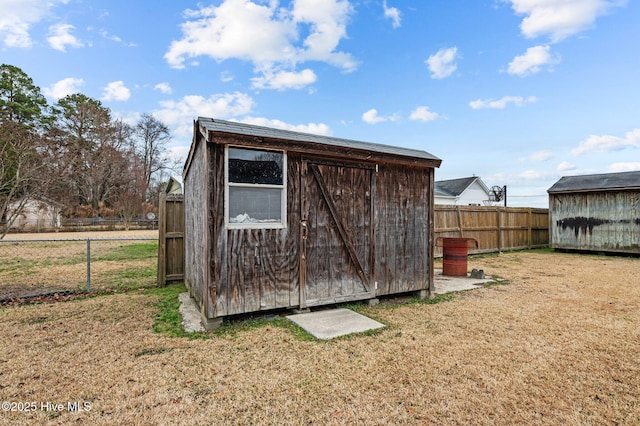 view of outbuilding featuring a yard