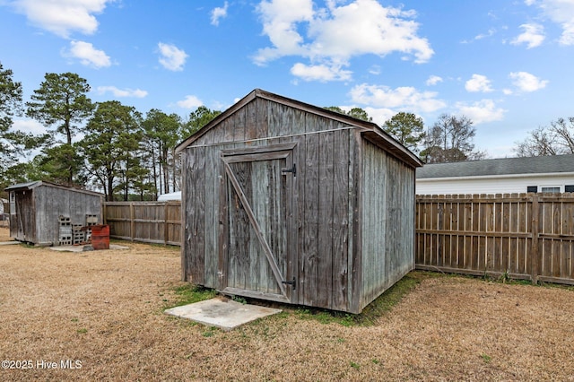 view of outbuilding featuring a yard