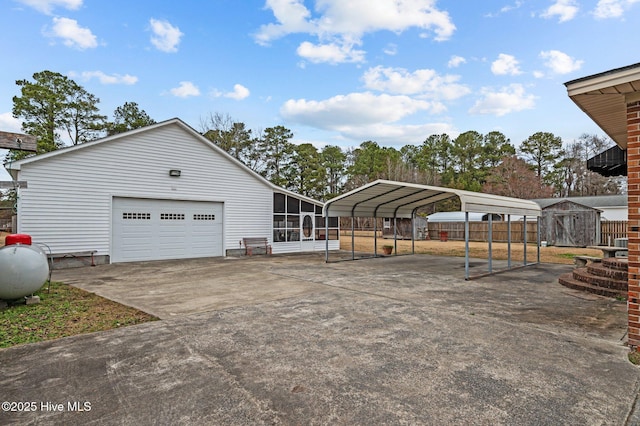 exterior space featuring a carport, a storage shed, and a sunroom