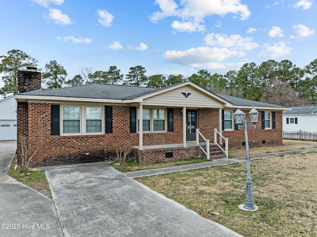 view of front of property featuring a garage and a front lawn