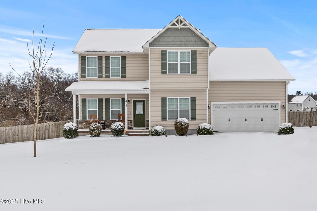 view of front of home featuring a garage and covered porch