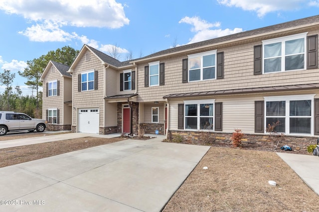 multi unit property featuring a garage