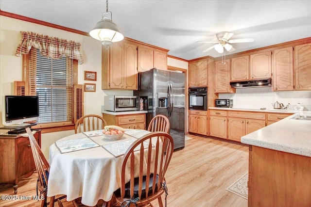 kitchen featuring decorative light fixtures, ornamental molding, ceiling fan, stainless steel appliances, and light hardwood / wood-style flooring