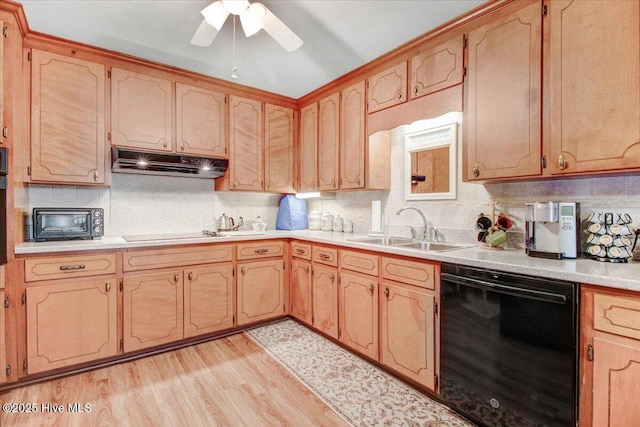 kitchen featuring sink, backsplash, ceiling fan, black appliances, and light hardwood / wood-style flooring