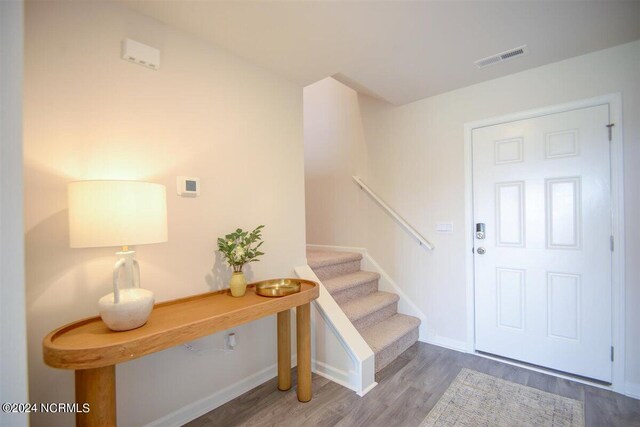 living room featuring light hardwood / wood-style flooring and a wealth of natural light