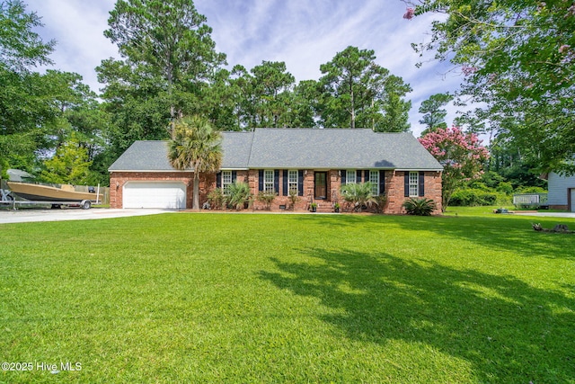 view of front facade with a garage and a front lawn