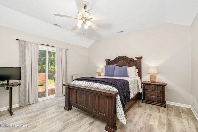 bedroom featuring ceiling fan, light hardwood / wood-style floors, vaulted ceiling, and access to outside