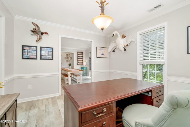 office with ornamental molding and light hardwood / wood-style flooring