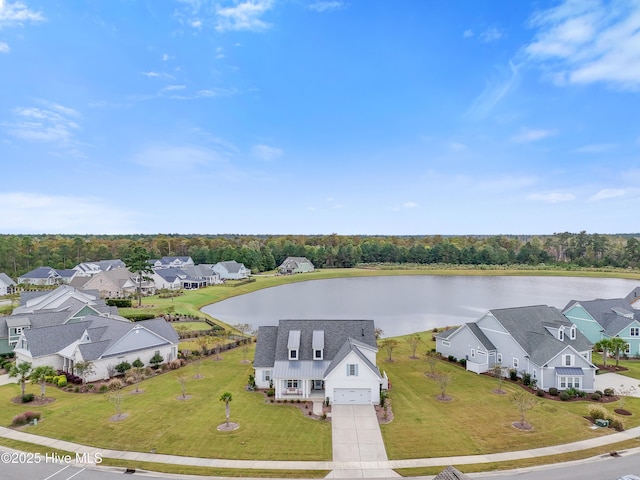 drone / aerial view with a residential view and a water view