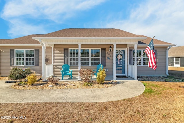 view of front of property with a front yard and a porch