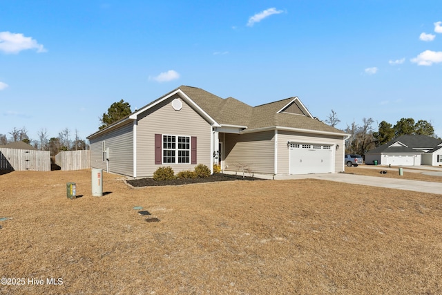 view of front of house with a garage and a front lawn