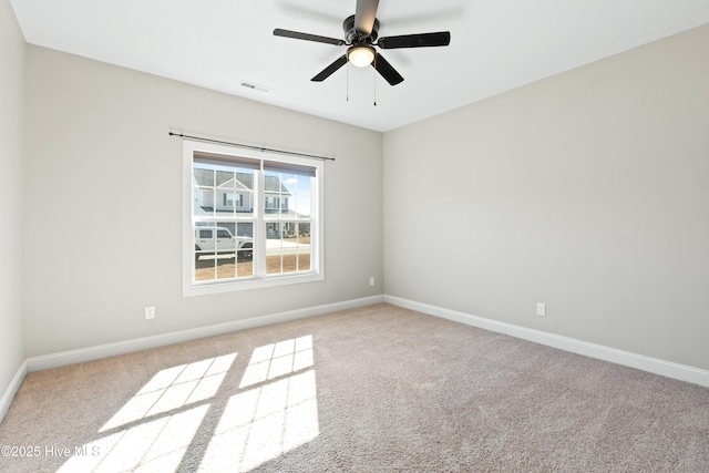 unfurnished room with light carpet and ceiling fan