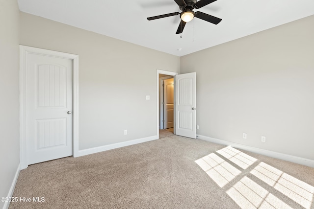 unfurnished bedroom featuring ceiling fan and light carpet