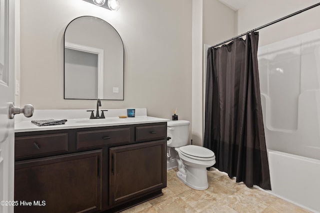 full bathroom featuring toilet, vanity, and shower / bathtub combination with curtain