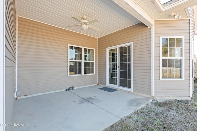 view of patio featuring ceiling fan