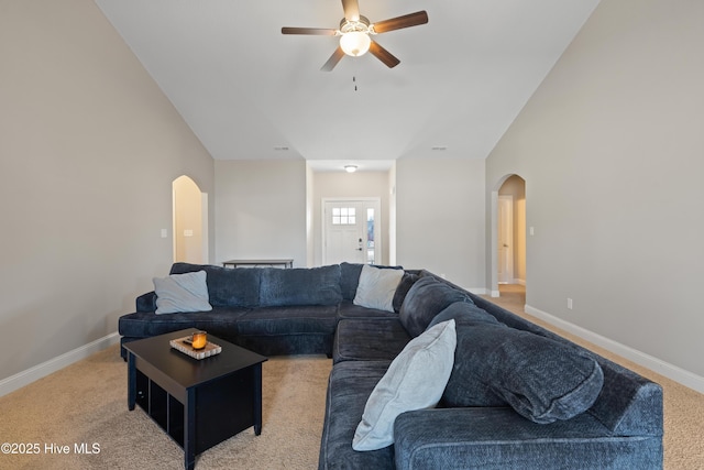 living room with ceiling fan, light colored carpet, and lofted ceiling