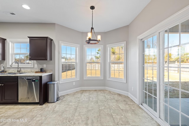 kitchen with sink, hanging light fixtures, stainless steel dishwasher, a notable chandelier, and dark brown cabinetry