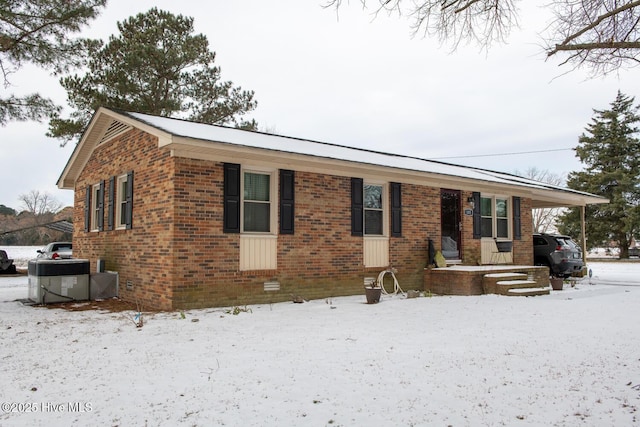 single story home featuring central air condition unit