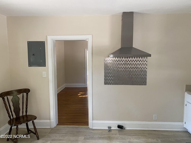 dining space featuring hardwood / wood-style flooring and electric panel