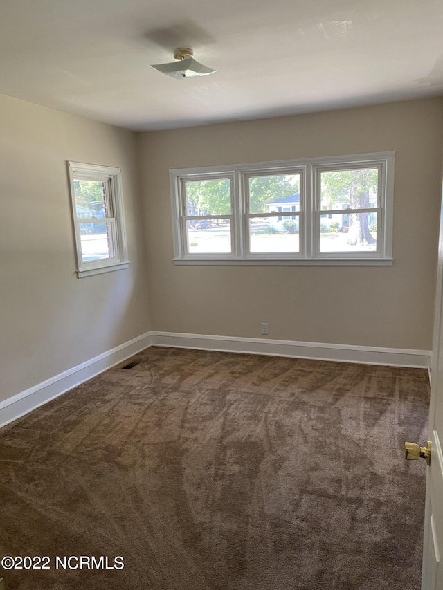 empty room featuring carpet