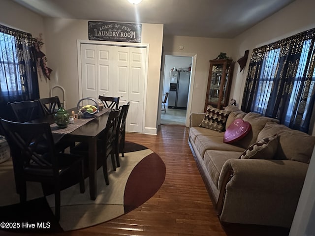 dining room with dark hardwood / wood-style flooring