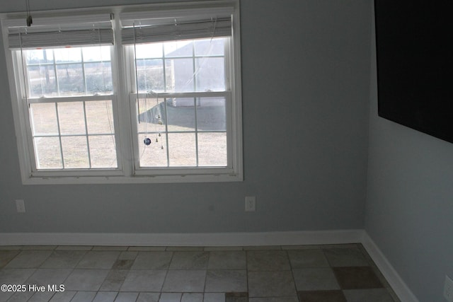 spare room featuring a healthy amount of sunlight