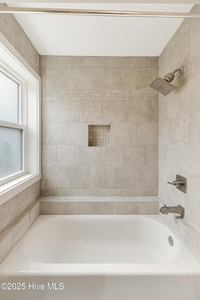 bathroom with washtub / shower combination