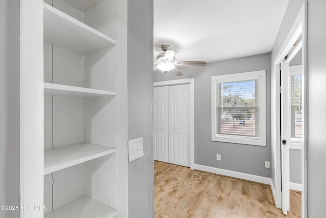 110 NE 29th St, Oak Island, NC 28465 - walk in closet featuring ceiling fan and wood finished floors