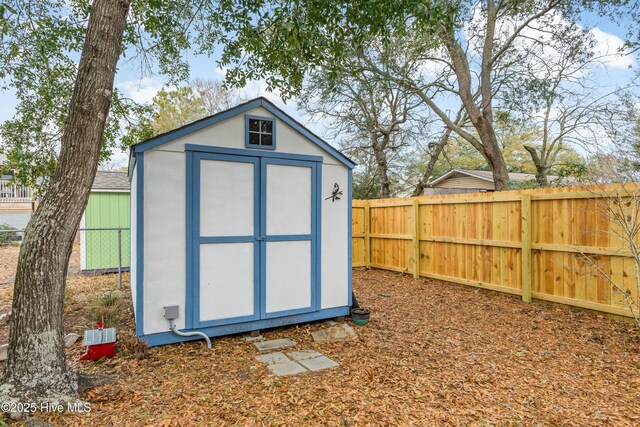 view of shed featuring a fenced backyard
