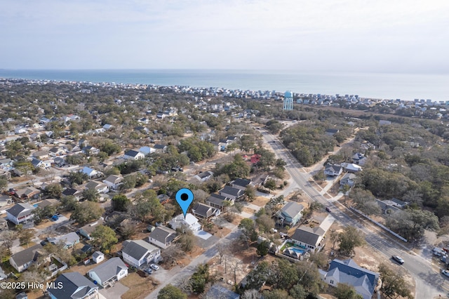 birds eye view of property with a residential view and a water view