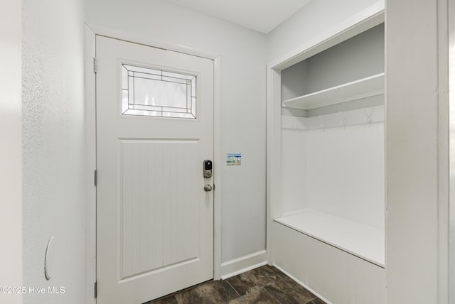 110 NE 29th St, Oak Island, NC 28465 - mudroom featuring dark stone finish flooring and baseboards