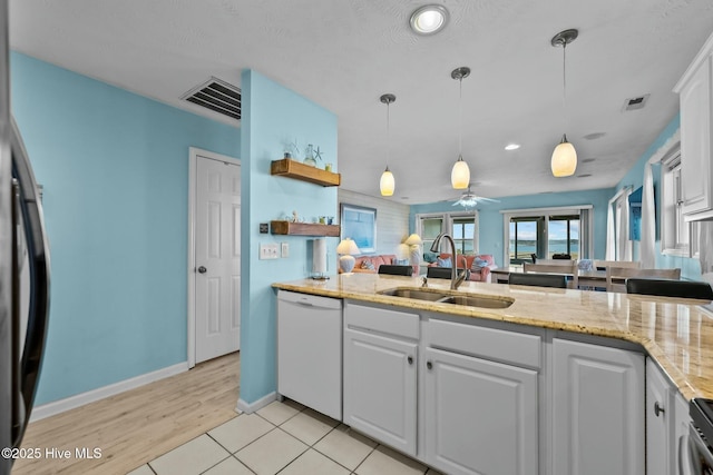 kitchen with white cabinetry, pendant lighting, dishwasher, and sink