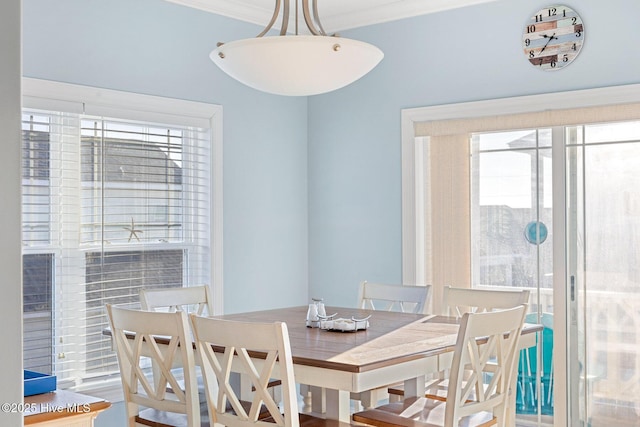 dining room with crown molding