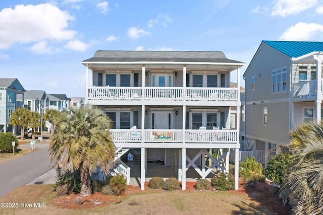 exterior space with a carport and a balcony