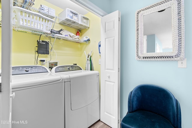 washroom featuring laundry area and washer and clothes dryer