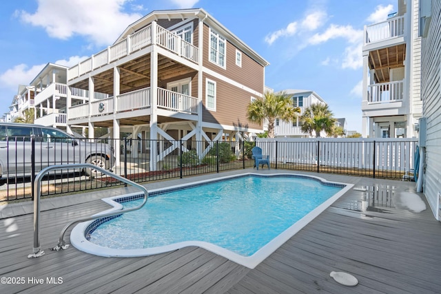 view of swimming pool featuring a fenced in pool and fence