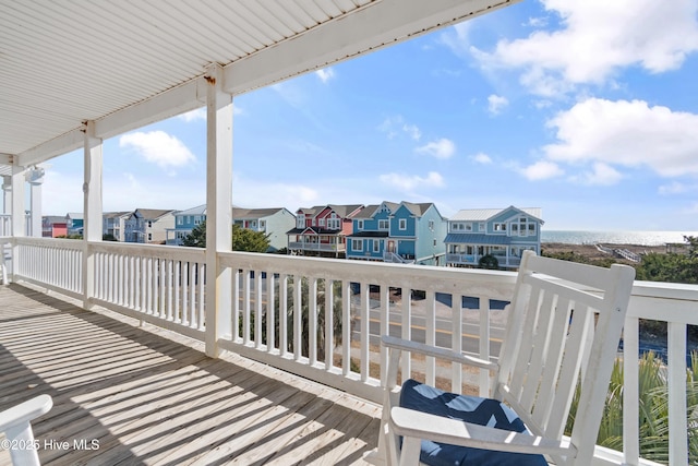 wooden deck with a residential view