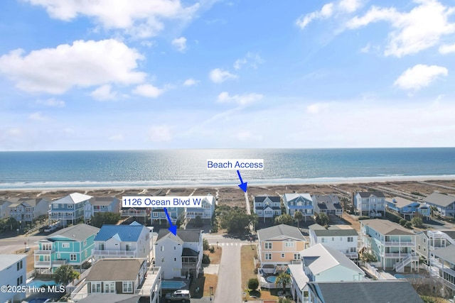 bird's eye view with a water view and a residential view