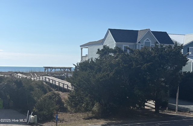 exterior space with a water view