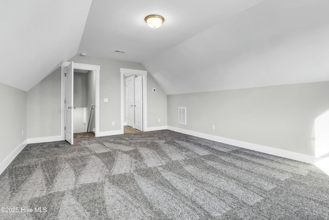 143 Talbert Dr, Rocky Point, NC 28457 - bonus room featuring dark colored carpet and vaulted ceiling
