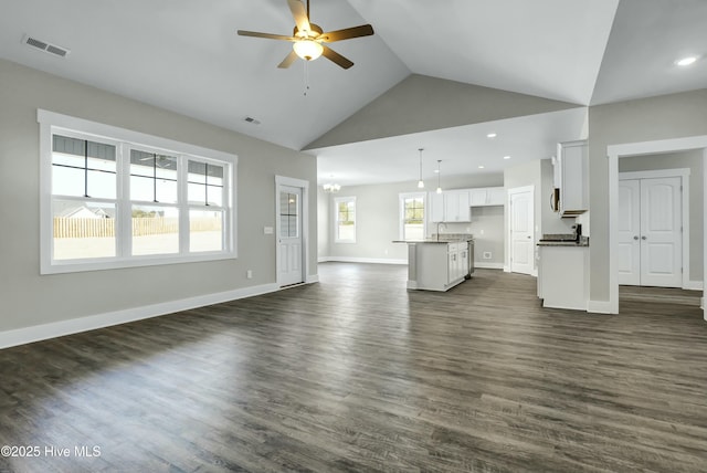 143 Talbert Dr, Rocky Point, NC 28457 - unfurnished living room featuring dark hardwood / wood-style flooring, sink, ceiling fan with notable chandelier, and high vaulted ceiling