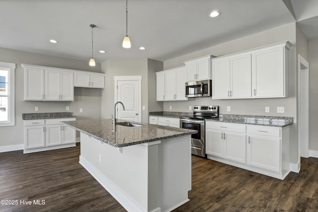 143 Talbert Dr, Rocky Point, NC 28457 - kitchen with dark stone countertops, sink, white cabinetry, and stainless steel appliances