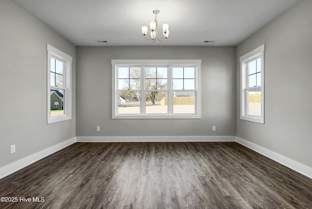 143 Talbert Dr, Rocky Point, NC 28457 - unfurnished dining area featuring dark wood-type flooring and a notable chandelier