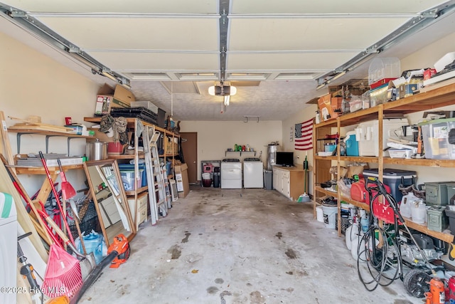 garage featuring a garage door opener and separate washer and dryer