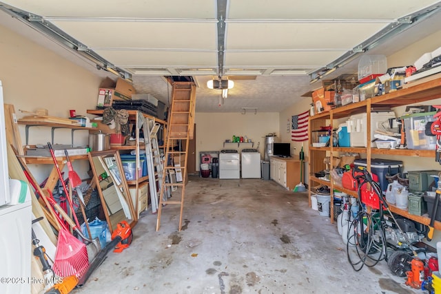 garage with a garage door opener and washer and clothes dryer